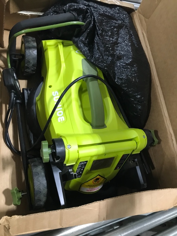 Photo 1 of Sun Joe MJ403E 17-Inch 13-Amp Electric Lawn Mower/Mulcher, 7-Position Adjustment, 12-Gallon Detachable Grass Collection Bag, Lightweight, Standard, Green

