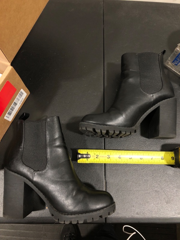 Photo 1 of BLACK BOOTIE HEELS SIZE UNKNOWN