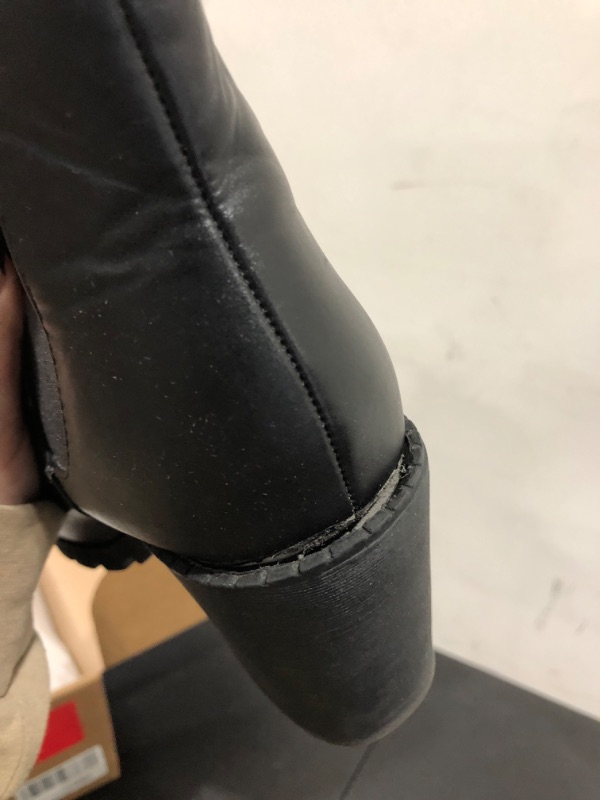 Photo 1 of BLACK BOOTIE HEELS SIZE UNKNOWN
