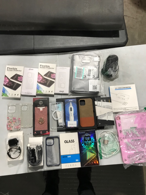 Photo 1 of Phone case bundle with various cases and electronics **items sold as is ** 