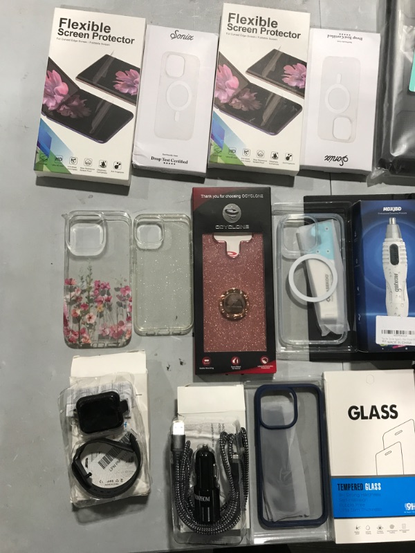 Photo 2 of Phone case bundle with various cases and electronics **items sold as is ** 