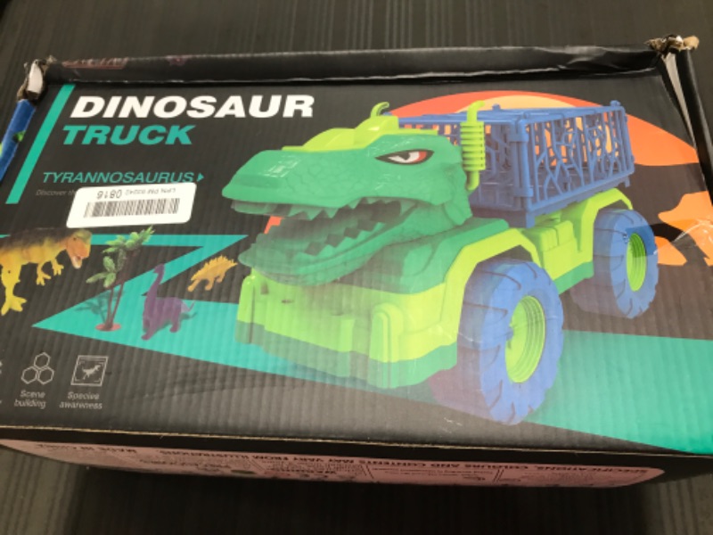 Photo 1 of Dinosaur Truck & Figures