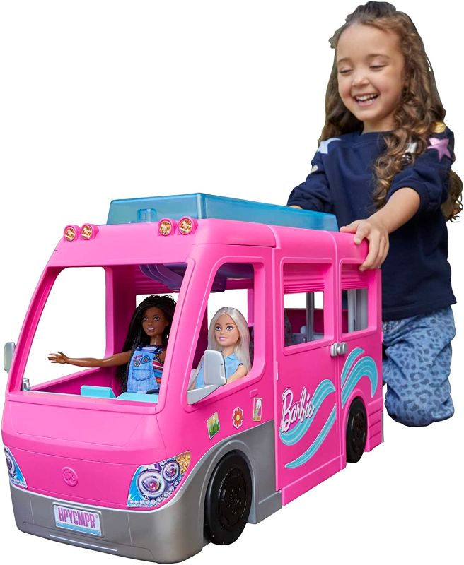 Photo 1 of Barbie Camper, DreamCamper Toy Playset with 60+ Barbie Accessories and Furniture Pieces, 7 Play Areas Including Pool and Slide
