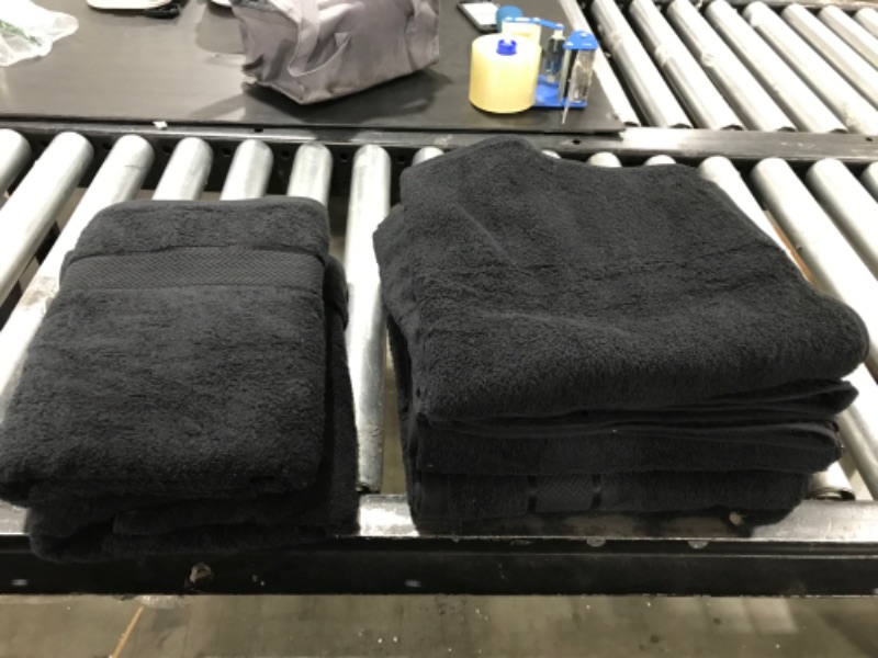 Photo 1 of 4 large towels and 2 hand towels black 