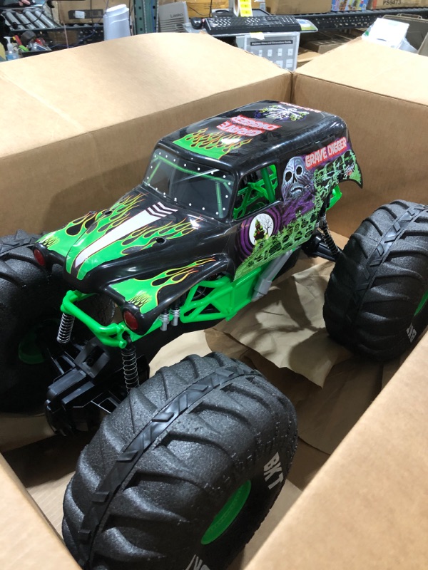 Photo 2 of Axial SMT10 Grave Digger RC Monster Truck RTR with 2.4GHz Radio Transmitter System (Battery and Charger Not Included): 1/10 Scale AXI03019, Black & Green
