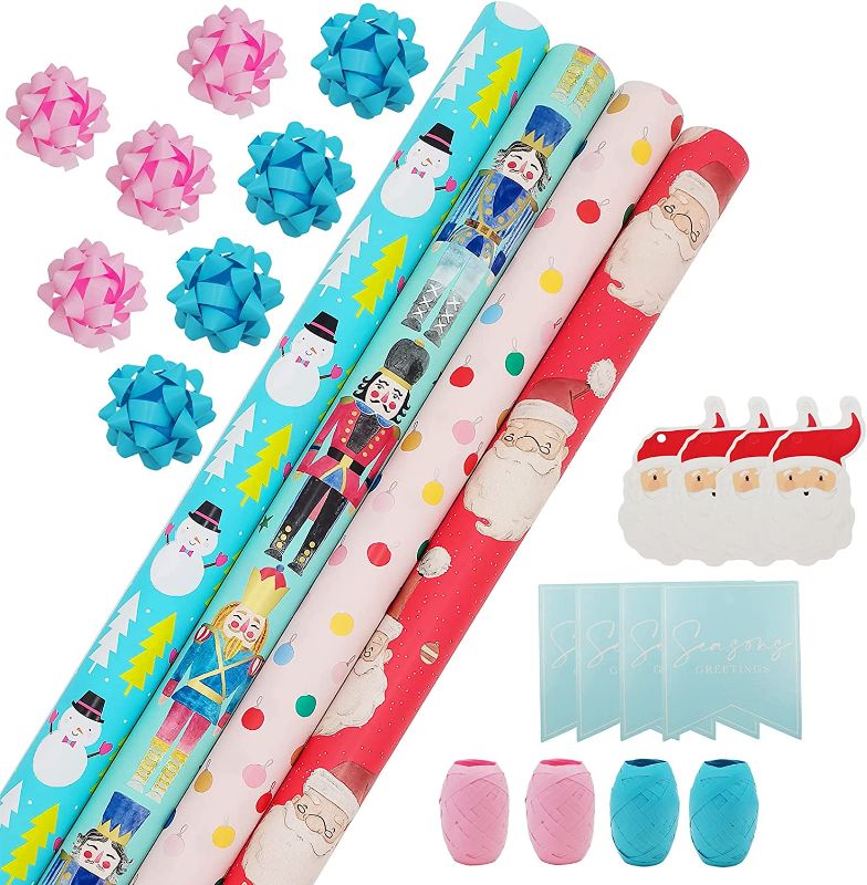 Photo 1 of Wrapping Paper, Christmas Wrapping Paper for Kids Boys, Girls, baby. 4 Cute Designs Including Santa, Christmas Lights, Snowman, Nutcracker. Includes Decorative Flowers, Ribbons, Labels. Each Roll of Gift Wrap Paper Measures 27.5 In X 13 ft 