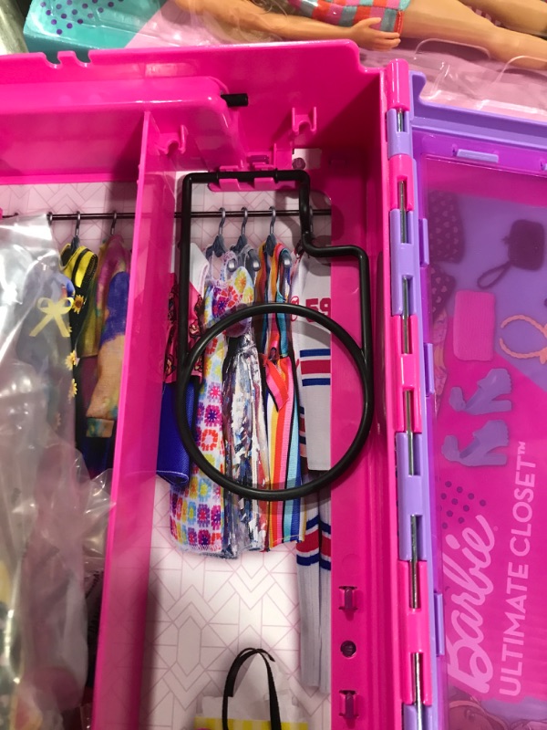 Photo 1 of Barbie Fashionistas Ultimate Closet Portable Fashion Toy with Doll, Clothing, Accessories and Hangers, Gift for 3 Years Old and Up Purple Closet with Doll