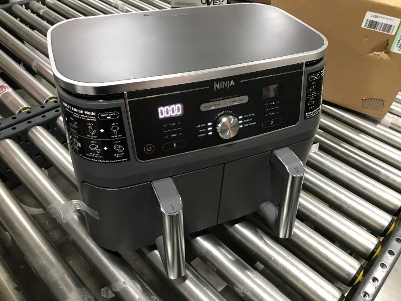 Photo 2 of Ninja DZ401 Foodi 10 Quart 6-in-1 DualZone XL 2-Basket Air Fryer with 2 Independent Frying Baskets, Match Cook & Smart Finish to Roast, Broil, Dehydrate & More for Quick, Easy Family-Sized Meals, Grey

