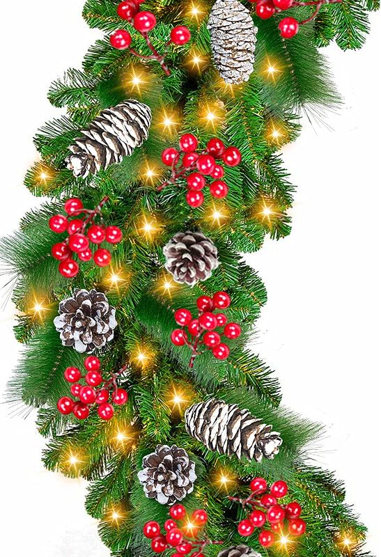 Photo 1 of [ Timer & 8 Modes ] 9 Foot by 10 Inch Christmas Garland Decorations 100 LED Lights Battery Operated Lighted Garland 250 Branches 198 Red Berries 18 Pine Cones Xmas Garland Indoor Outdoor (Warm White)
