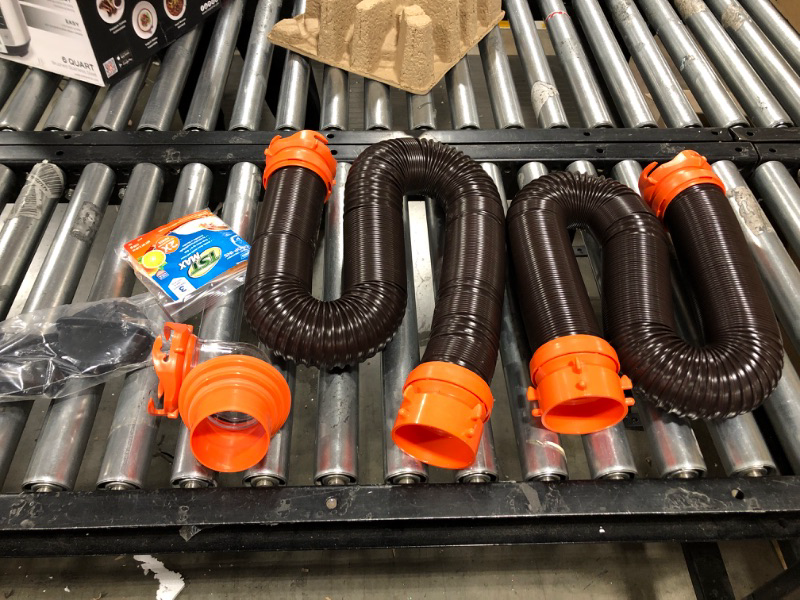 Photo 2 of Camco 20' (39742) RhinoFLEX 20-Foot RV Sewer Hose Kit, Swivel Transparent Elbow with 4-in-1 Dump Station Fitting-Storage Caps Included , Black , Brown 20ft Sewer Hose Kit Frustration-Free Packaging