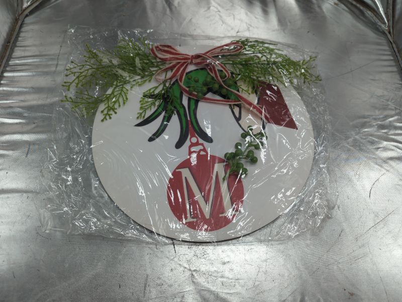 Photo 1 of 12" Round Grinch Door Sign - Grinch Hand Holding Ornament - Letter M