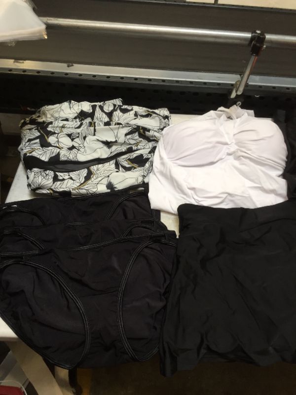 Photo 1 of BAG LOT OF WOMEN BATHING SUITS --DIFFERENT STYLES AND SIZES --- SOLD AS IS --- 