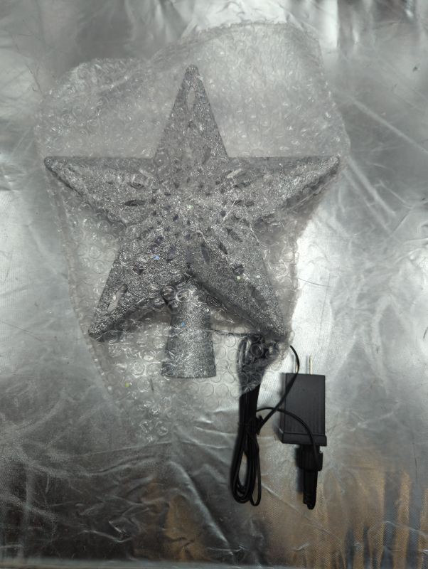 Photo 3 of Christmas Tree Topper Lighted Star [Silver],3D Hollow Sparkling Star Christmas Tree Topper with Rotating Magic Cool White Snowflake Projector for Christmas Tree Ornament (Silver)
