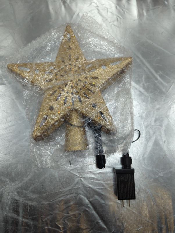 Photo 3 of Christmas Tree Topper Lighted Star [Gold],3D Hollow Sparkling Star Christmas Tree Topper with Rotating Magic Cool White Snowflake Projector for Christmas Tree Ornament (Gold)
