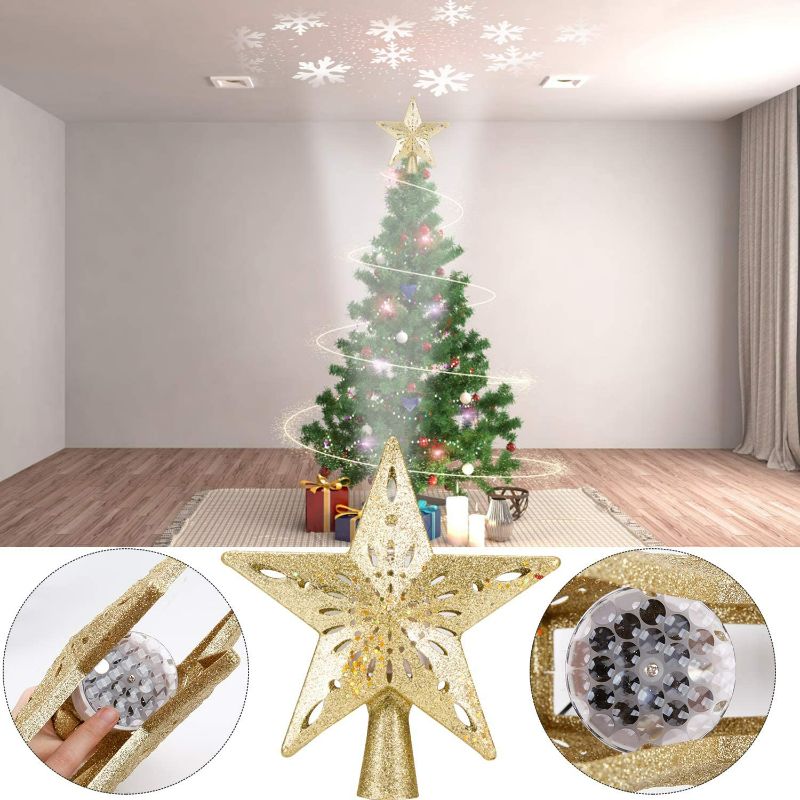 Photo 2 of Christmas Tree Topper Lighted Star [Gold],3D Hollow Sparkling Star Christmas Tree Topper with Rotating Magic Cool White Snowflake Projector for Christmas Tree Ornament (Gold)

