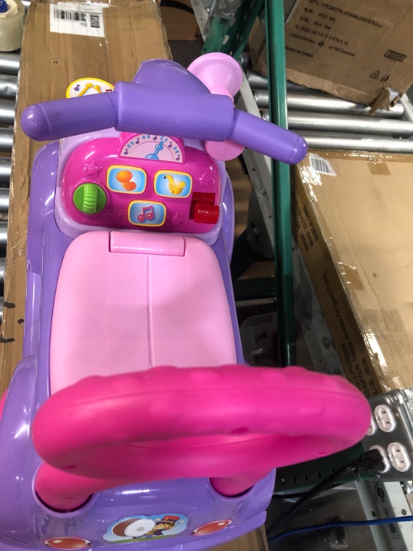 Photo 3 of Fisher Price Music Parade Purple Ride-On 