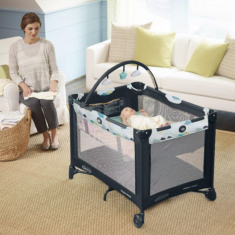 Photo 4 of Graco Pack and Play On the Go Playard | Includes Full-Size Infant Bassinet, Push Button 