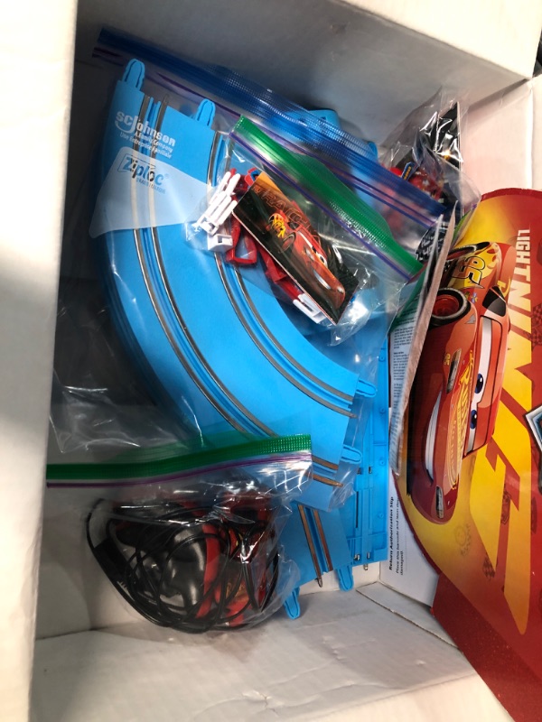 Photo 3 of Carrera First Disney/Pixar Cars - Slot Car Race Track - Includes 2 Cars: Lightning McQueen and Dinoco Cruz - Battery-Powered Beginner Racing Set for Kids Ages 3 Years and Up Disney Cars w/ Spinners