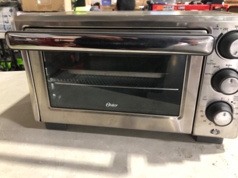 Photo 2 of *MINOR DAMAGE*
Oster Compact Countertop Oven With Air Fryer, Stainless Steel