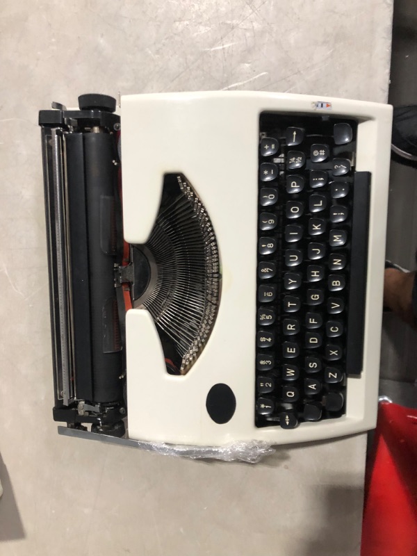 Photo 4 of **MINOR DAMAGE PREV USED**
Traditional Portable Manual Typewriter