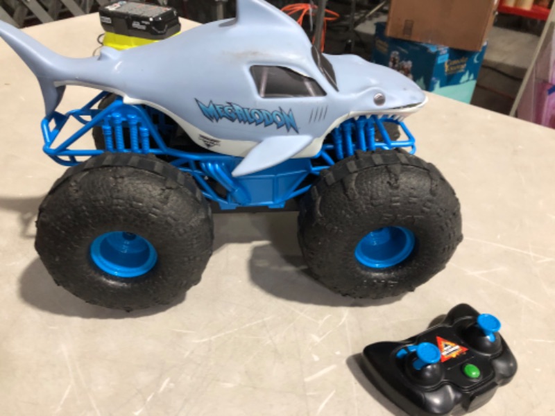 Photo 3 of *MINOR DAMAGE- DOES NOT FUNCTION*
Monster Jam, Official Megalodon Storm All-Terrain Remote Control Monster Truck Toy