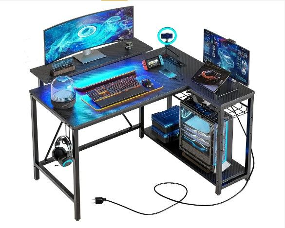 Photo 1 of Bestier Small L Shaped Gaming Desk with Power Outlets,42 inch LED Computer Desk with Monitor Stand Reversible Storage Shelves Corner Gamer Desk with Headset Hooks USB Charging Port,Carbon Fiber Black