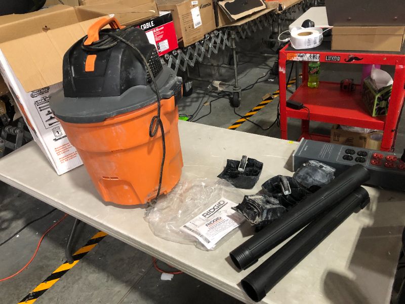 Photo 2 of ***HEAVILY USED AND DIRTY - POWERS ON - SEE PICTURES***
RIDGID 12 Gal. 5.0-Peak HP NXT Wet/Dry Shop Vacuum with Filter, Hose and Accessories