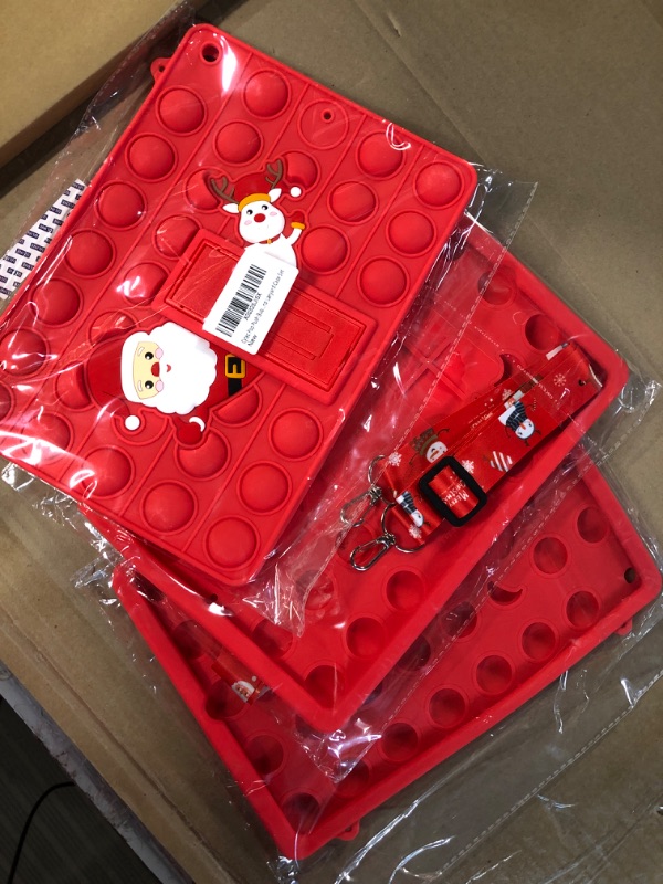 Photo 1 of POP IT SANTA IPAD CASE 3PK