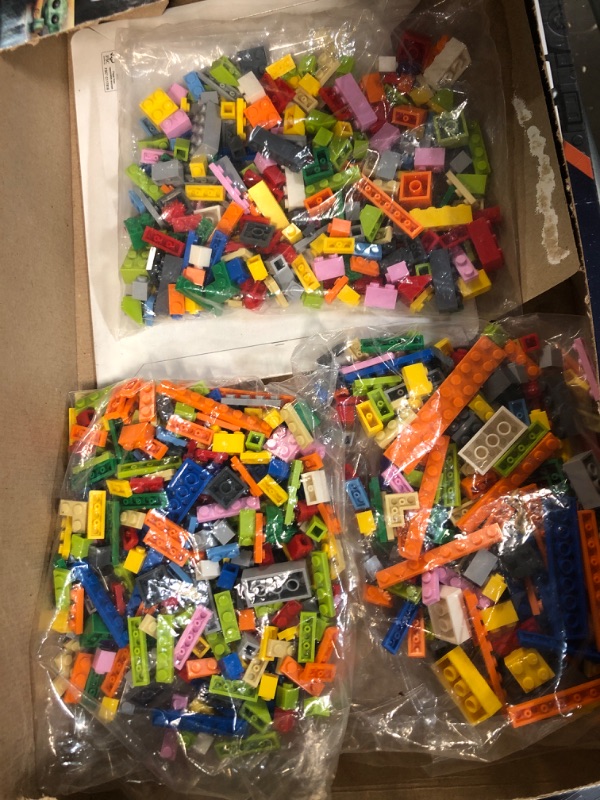 Photo 1 of 3 small bags of miscellaneous Legos