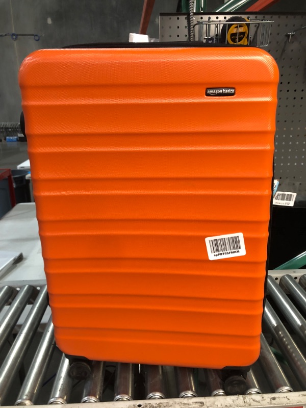 Photo 2 of * USED * 
Amazon Basics 30-Inch Hardside Spinner, Orange Orange 30-inch Spinner