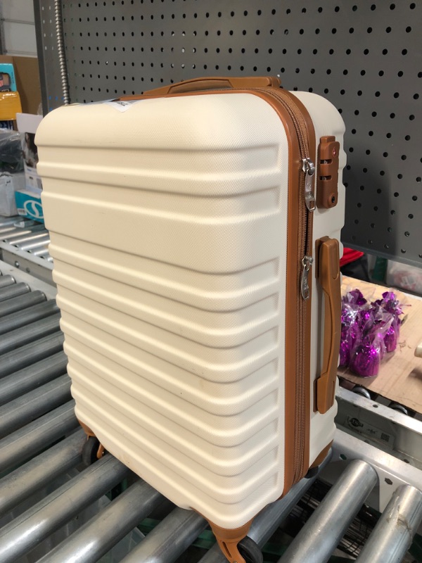 Photo 2 of 20' cream colored lugagge/suitcase