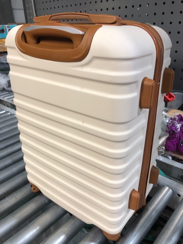 Photo 1 of 20' cream colored lugagge/suitcase