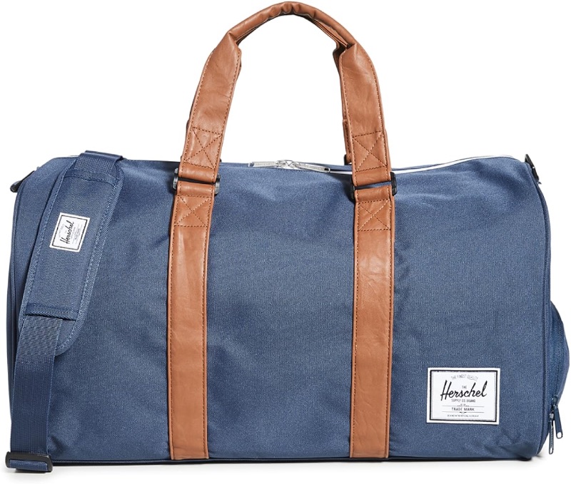 Photo 1 of **SEE NOTES**
Herschel Novel Duffel Bag, Navy/Tan Synthetic Leather, Classic 42.5L