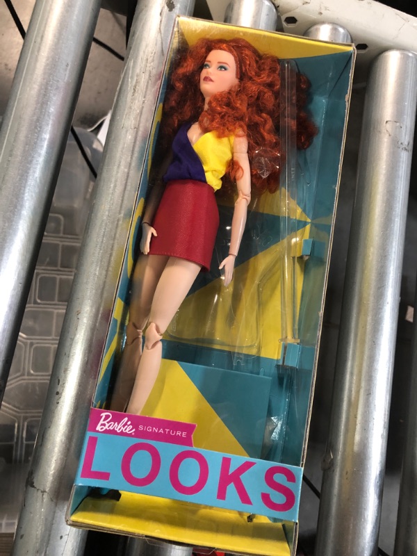 Photo 2 of Barbie Looks Doll with Curly Red Hair Dressed in Color Block Top and Glossy Pleather Skirt, Posable Made to Move Body Red Curly Hair