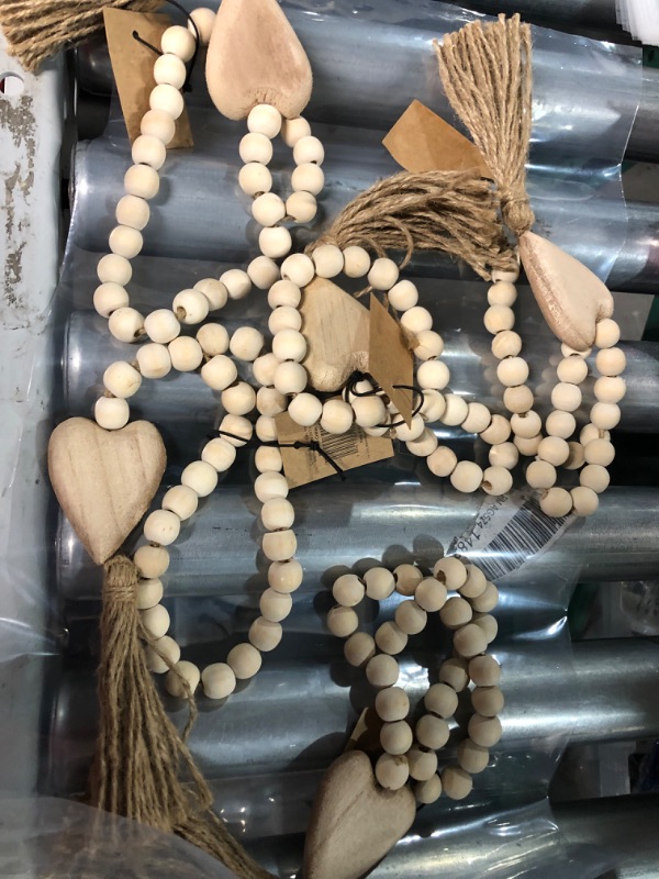 Photo 2 of *5 PACK*Creative Co-Op Paulownia Wood Beads with Heart Pendant & Jute Tassel Garland, Cream