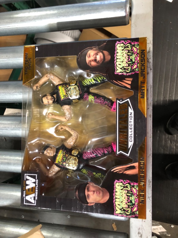 Photo 1 of All Elite Wrestling AEW UNRIVALED 2 Pack - The Young Bucks - 6-Inch Matt Jackson and Nick Jackson Figures with Accessories, Multi 