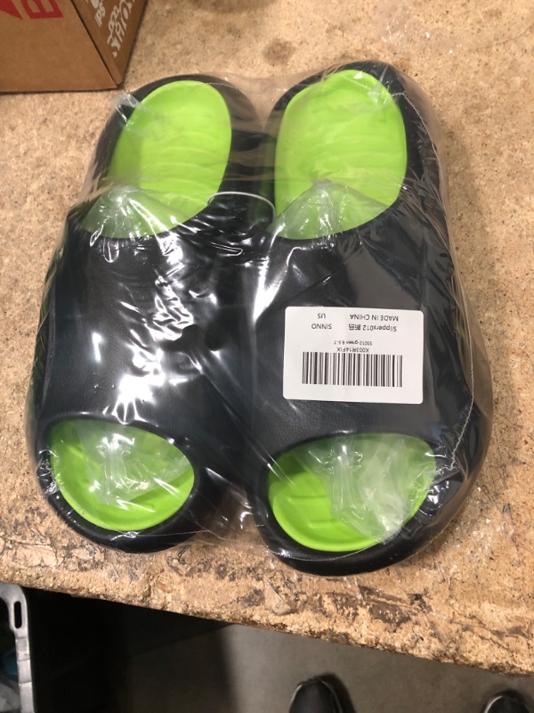 Photo 1 of BLACK AND GREEN SLIDES SIZE 6.5-7