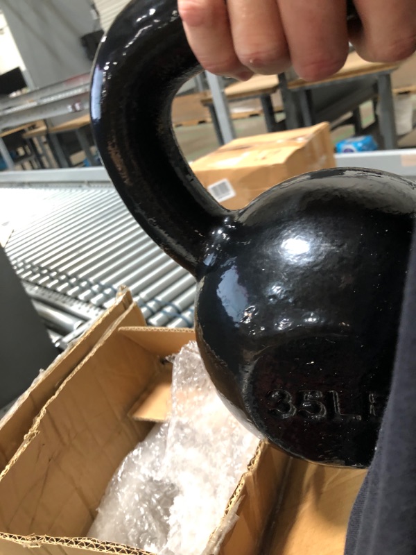 Photo 2 of **35 POUNDS**  Amazon Basics Enamel Cast Iron Kettlebell - 35 Pounds, Black & Cast Iron Kettlebell - 