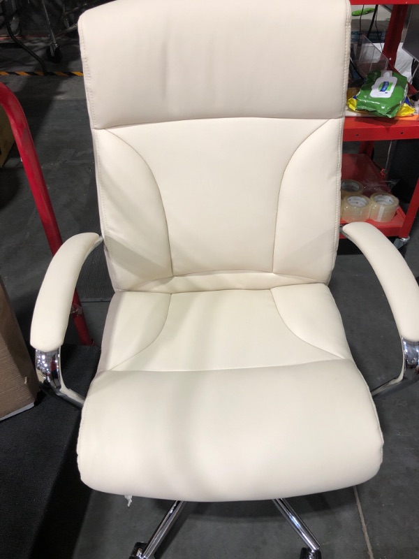 Photo 2 of * item used * damaged * see all images *
Amazon Basics Modern Executive Chair, 275lb Capacity with Oversized Seat Cushion, Ivory Bonded Leather