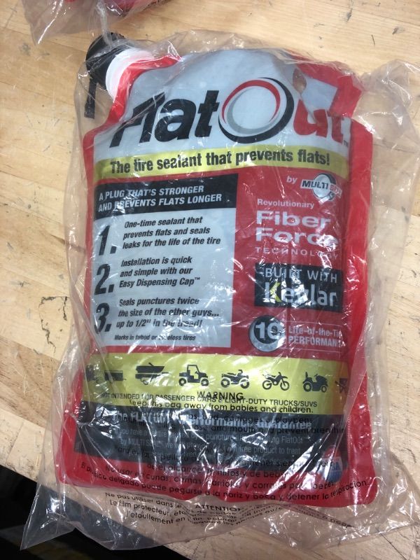 Photo 2 of FlatOut Multi-Purpose Tire Sealant - Prevents and Repairs Flat Tires, Seals Leaks, Contains Kevlar, 32-Ounce Bag, 1-Pack 1-Pack (32 oz. Tire Sealant)