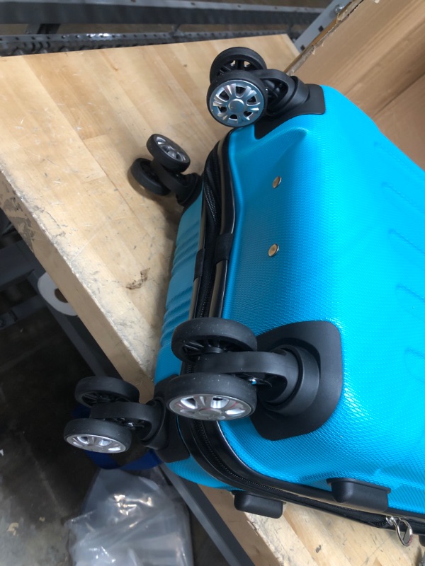 Photo 2 of **TOP RIGHT BACK CORNER IS DENTED INWARD**
Rockland London Hardside Spinner Wheel Luggage, Turquoise, Carry-On 20-Inch Carry-On 20-Inch Turquoise