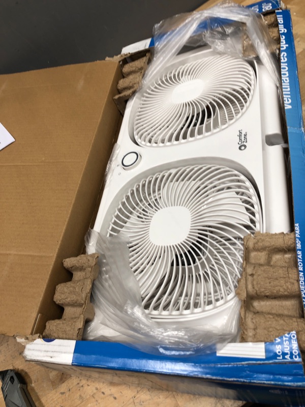 Photo 2 of **EACH FAN HAS ONE BROKEN PROPELLER**
Comfort Zone CZ319WT 9" Twin Window Fan with Reversible Airflow Control, Auto-Locking Expanders and 2-Speed Fan Switch, White 9" Portable Twin Window Fan Window Fan