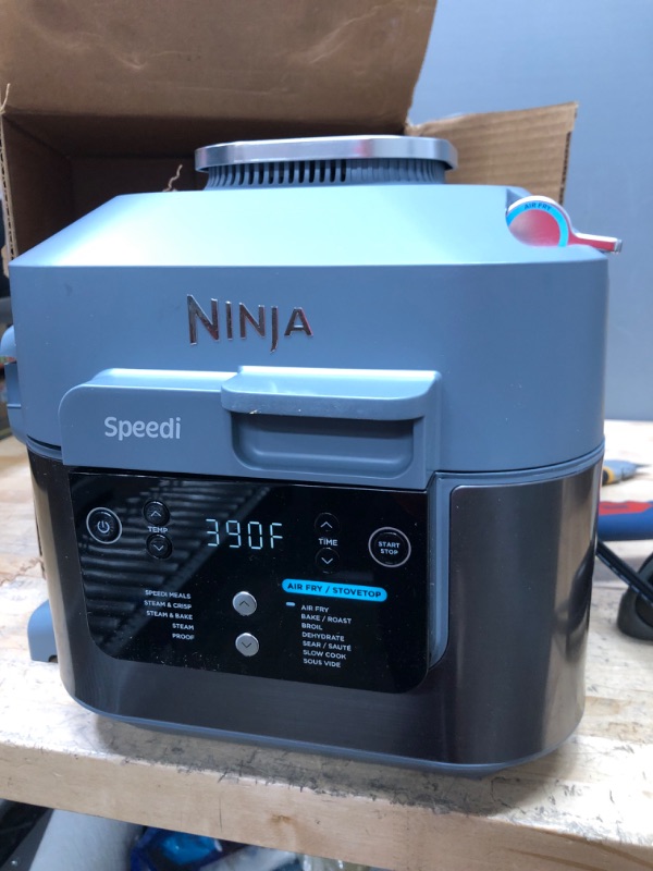 Photo 3 of ***BOTTOM LEFT SIDE IS BROKEN, SEE PHOTO***
Ninja SF301 Speedi Rapid Cooker & Air Fryer, 6-Quart Capacity, 12-in-1 Functions to Steam, Bake, Roast, Sear, Sauté, Slow Cook, Sous Vide & More, 15-Minute Speedi Meals All In One Pot, Sea Salt Gray

