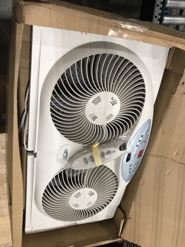 Photo 2 of ***NOT FUNCITONAL - DOES NOT TURN ON***
Bionaire Window Fan with Twin 8.5-Inch Reversible Airflow Blades and Remote Control