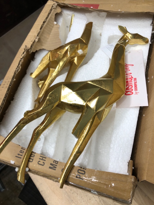 Photo 2 of **NEEDS TO BE REPAIRED IN SEVERAL PLACES**
CosmoLiving by Cosmopolitan Modern Polystone Giraffe Sculpture, Set of 2 12", 15"H, Gold