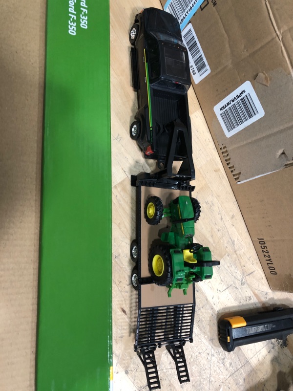 Photo 2 of **SEE NOTES**
ERTL 1:32 Scale Ford F350 Pickup and Tractor Set — Includes John Deere Tractor, Ford F350 Pickup and Gooseneck Trailer — 17.25 x 3.2 x 4.5 inches — Ages 3 Years and Up Tractor & Ford