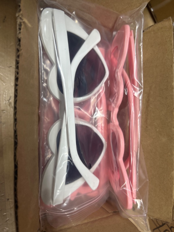 Photo 1 of AOOFFIV Heart Shape Sunglasses Rimless Transparent Candy Color Heart Glasses Love Eyewear Party Favors(8805-4ps white pink 