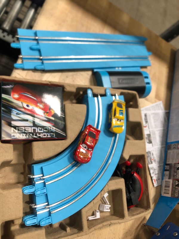 Photo 2 of Carrera First Disney/Pixar Cars - Slot Car Race Track - Includes 2 Cars: Lightning McQueen and Dinoco Cruz - Battery-Powered Beginner Racing Set for Kids Ages 3 Years and Up Disney Cars w/ Spinners