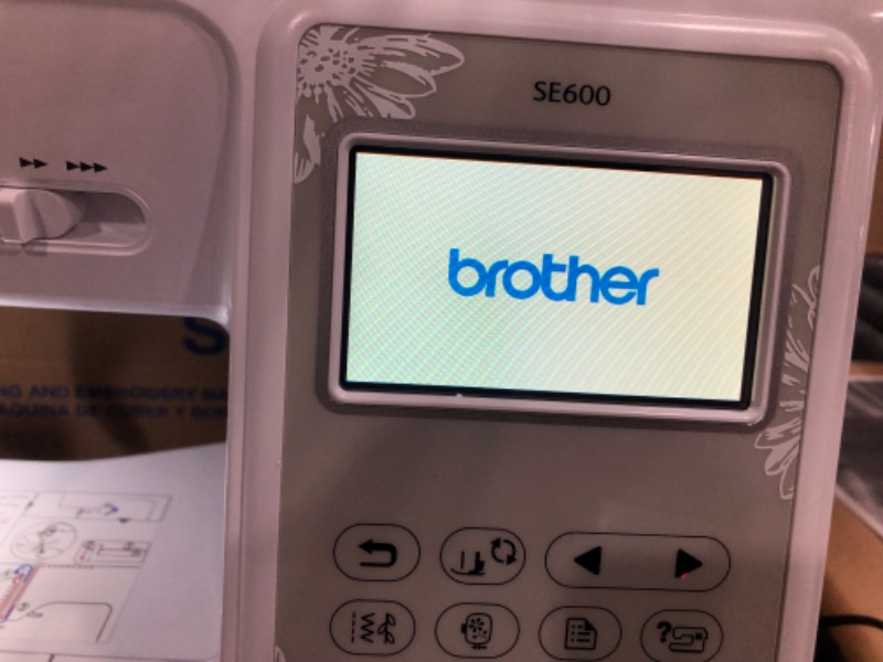 Photo 1 of **DAMAGED**Brother SE600 Sewing and Embroidery Machine, 80 Designs, 103 Built-In Stitches, Computerized, 4" x 4" Hoop Area, 3.2" LCD Touchscreen Display, 7 Included Feet