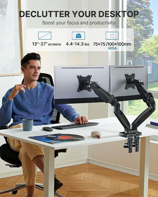 Photo 1 of HUANUO Dual Monitor Stand, Adjustable Spring Monitor Desk Mount for 13-27 inch, Dual Monitor Mount Holds Max 14.3lbs, Computer Monitor Arms with Wide Range of Motion for Home Office
